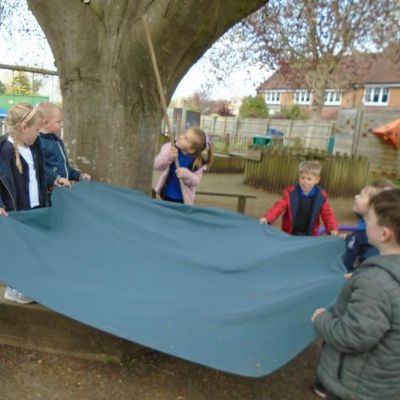 Can the children work together to rescue the monkey from the tree?